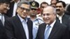 Pakistan's High Commissioner to India Salman Bashir, right, receives Indian Foreign Minister S.M. Krishna at Chaklala airbase in Rawalpindi, Pakistan, Sept. 7, 2012.