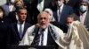 FILE - Rabbi Abraham Cooper, center, of the Simon Wiesenthal Center, speaks in front of civic and faith leaders outside City Hall, Thursday, May 20, 2021, in Los Angeles. 
