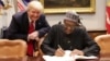Shugaba Buhari (a zaune) yayin wata ziyara da ya kai wa tsohon shugaban Amurka Trump (tsaye).