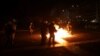 Protesters clash with police during an Athens, Greece, rally about a deadly 2023 train crash, March 7, 2025. 