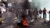 Protesters run as police, unseen, open fire into the air near the U.S. Embassy during a protest about a film ridiculing Islam's Prophet Muhammad, in Sanaa, Yemen, Thursday, Sept. 13, 2012. 