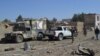 Afghan security personnel arrive at the site of a car bomb attack that targeted an intelligence unit in Ghazni, July 7, 2019. 