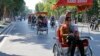Chinese tourists ride rickshaws for sightseeing in Hanoi, Vietnam, Dec. 1, 2016.