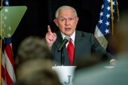 FILE - Jeff Sessions addresses the crowd at his watch party following Alabama's state primary, March 3, 2020, in Mobile, Ala.