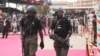 Nigerian police provide security during the ruling party's final campaign rally, at Eagle Square in Abuja, Nigeria, March 26, 2011. 