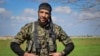 FILE - American volunteer William Savage is pictured during a training session with the Kurdish People’s Protection Units (YPG) in Syria. (Photo courtesy of the YPG Media Center)